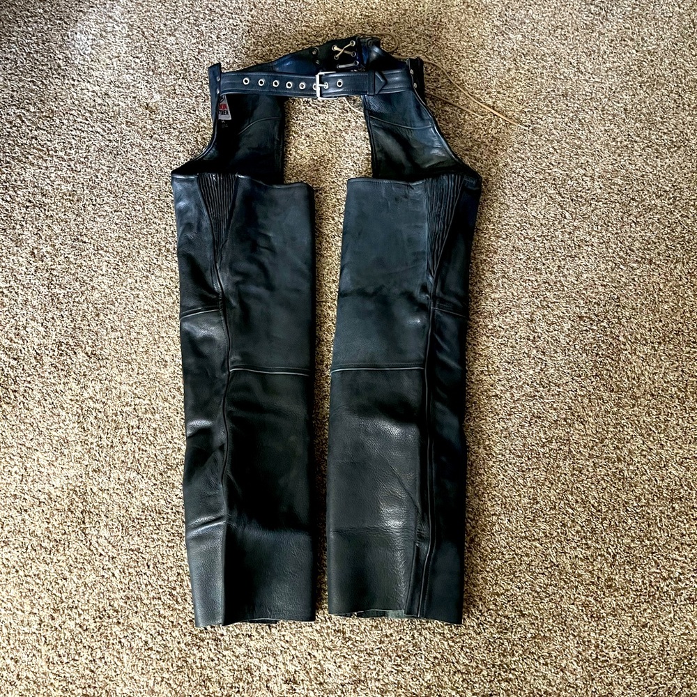 Black leather chaps with removable lining, size medium.